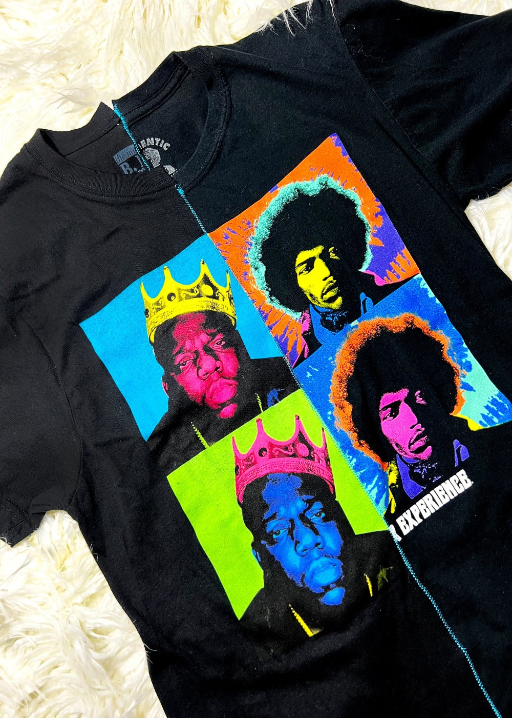 black t shirt on a white furry background close up