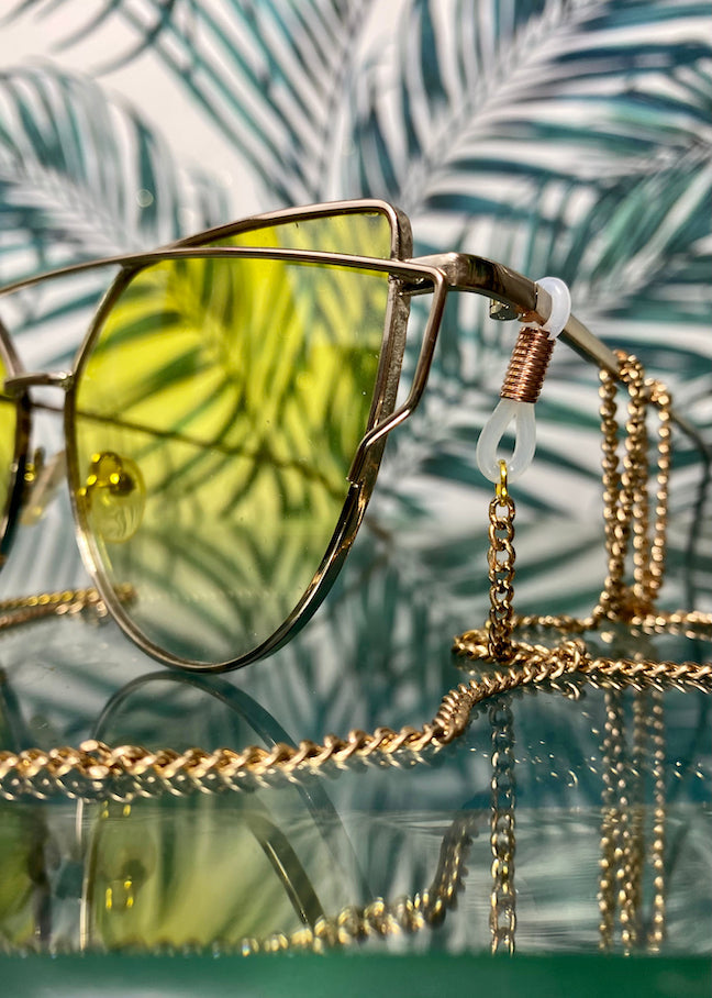 yellow glasses with gold chain affixed