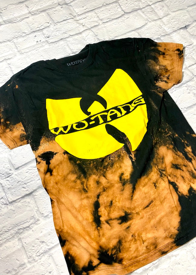 bleach dyed wu tang clan t shirt on a white brick background