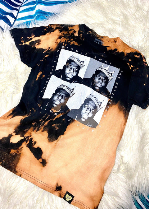 biggie bleach dye t shirt on a white furry background alternate angle