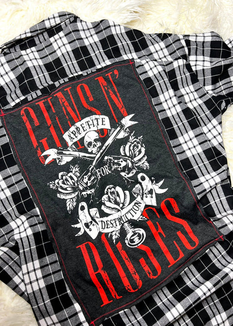 guns n roses flannel on a white furry background