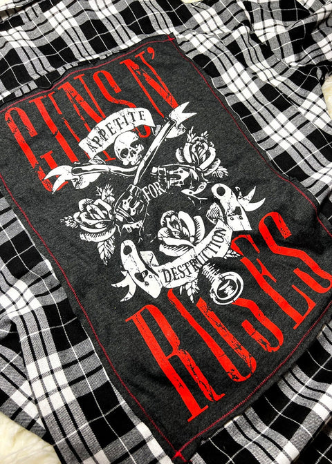guns n roses flannel on a white furry background close up