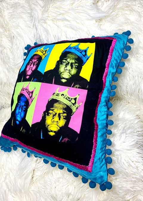 biggie throw pillow on a white furry background detail view