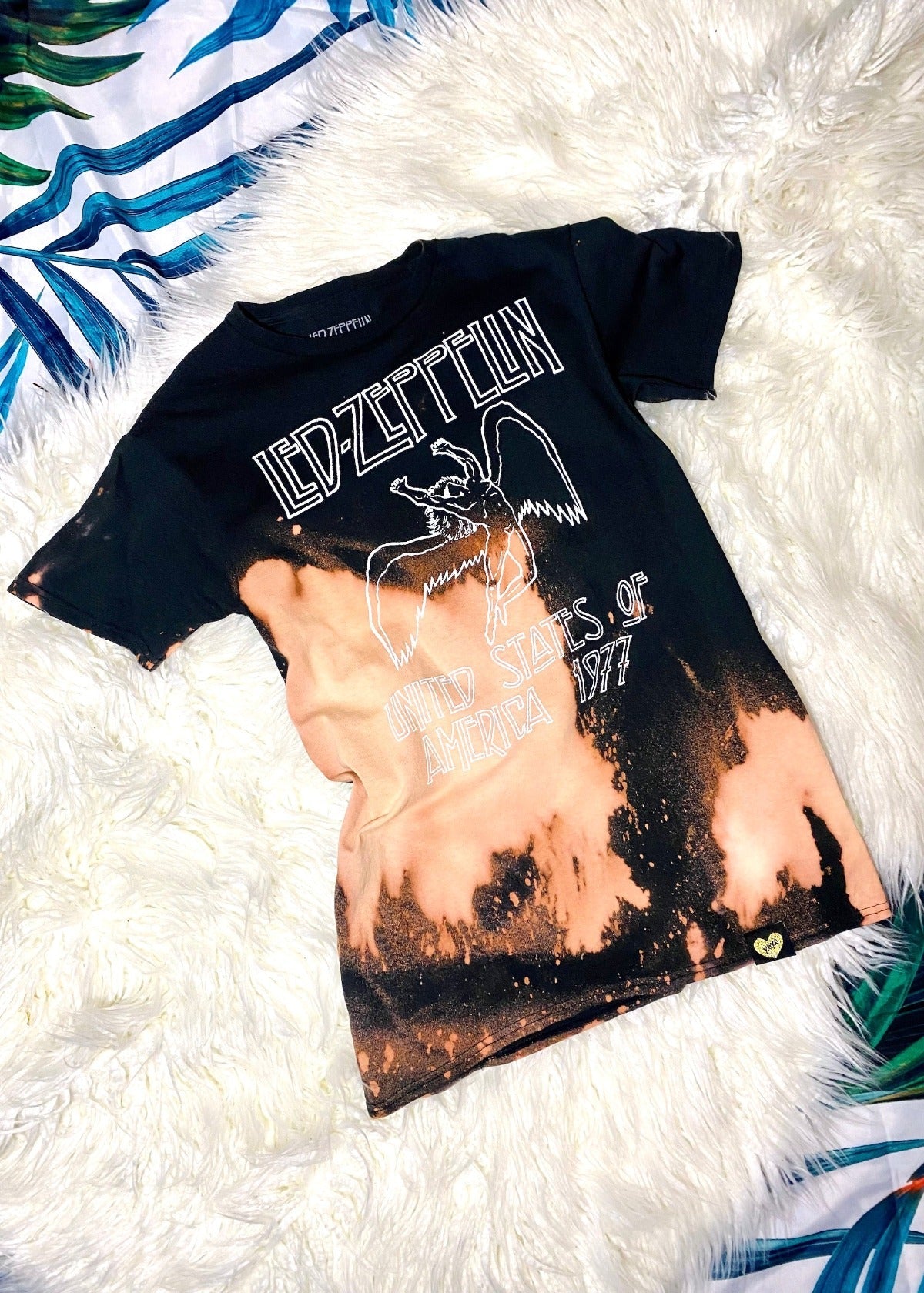 led zeppelin black bleach dyed t shirt on a white furry background angle shot