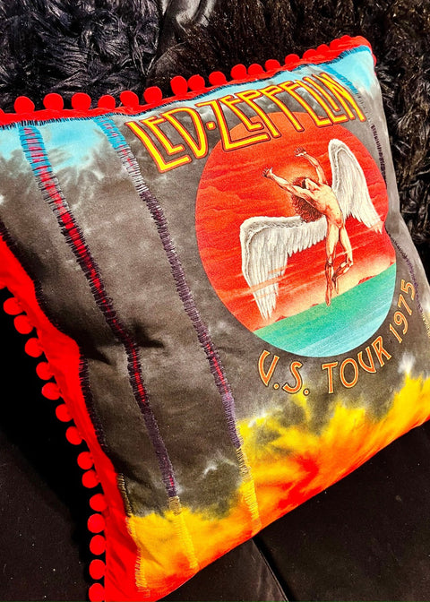 led zeppelin tie dye throw pillow on a dark furry background angle view