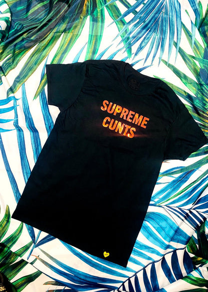 black graphic t shirt on a palm background full view